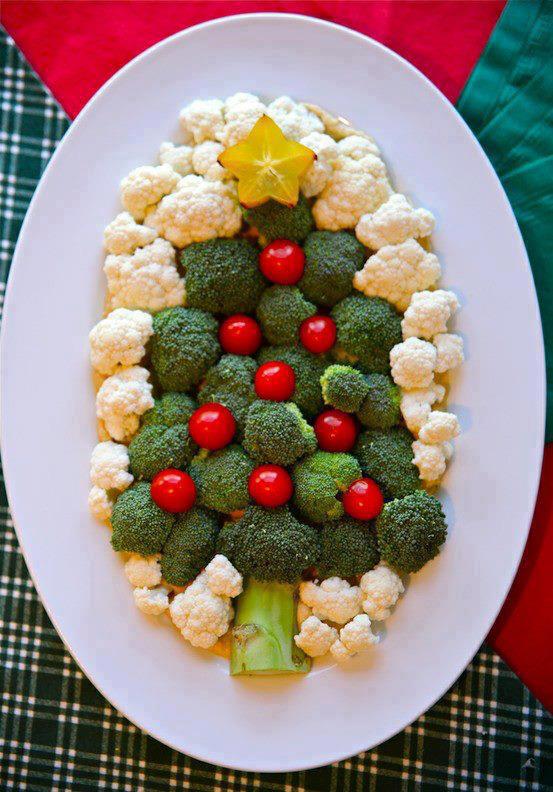 Christmas tree arrangement with broccoli, cauliflower and tomatoes on a plate